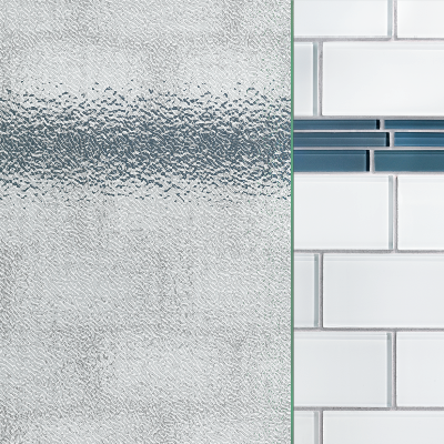 A close up of a white tile wall with a blue tile border with textured glass over it.