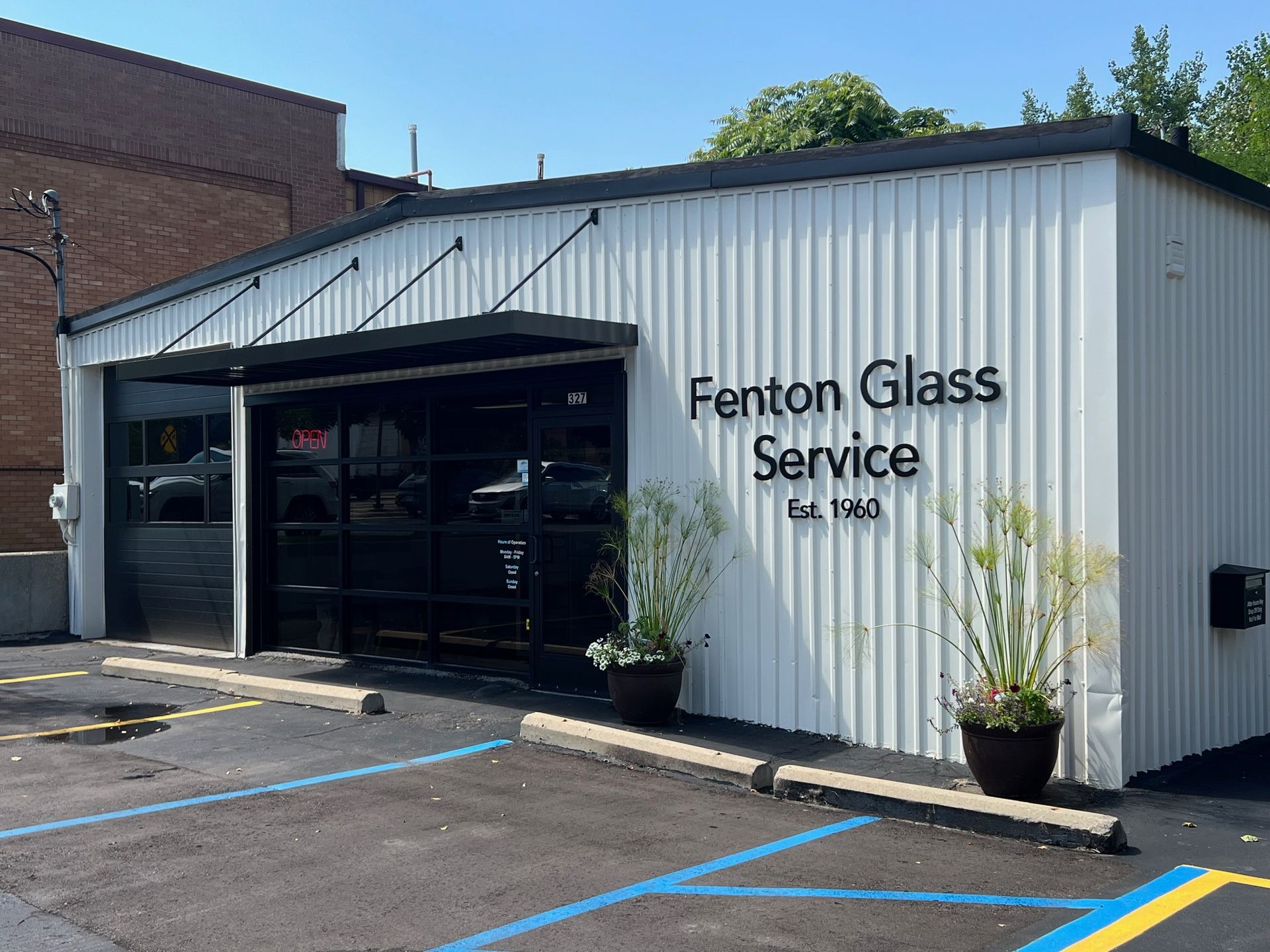 A white building with fenton glass service written on it.