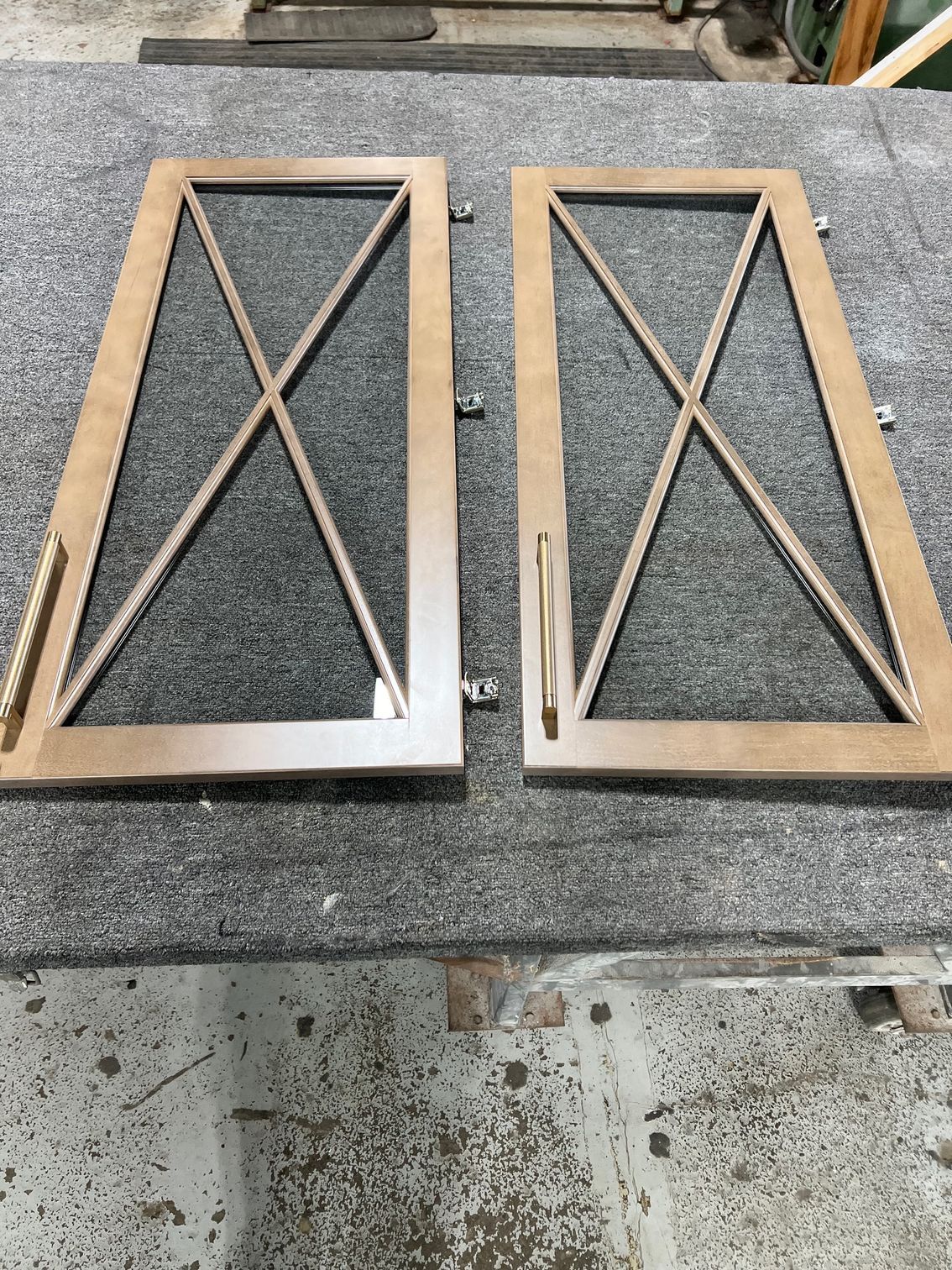 A pair of wooden doors sitting on top of a table.