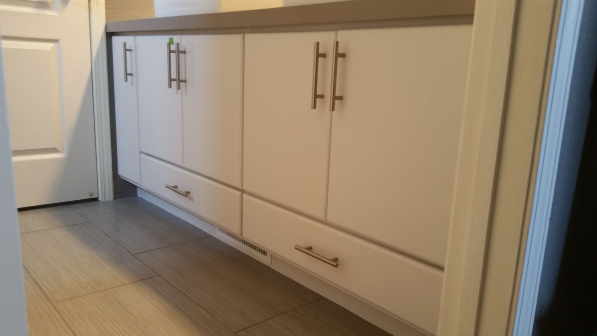 A kitchen with wooden cabinets and stainless steel appliances.