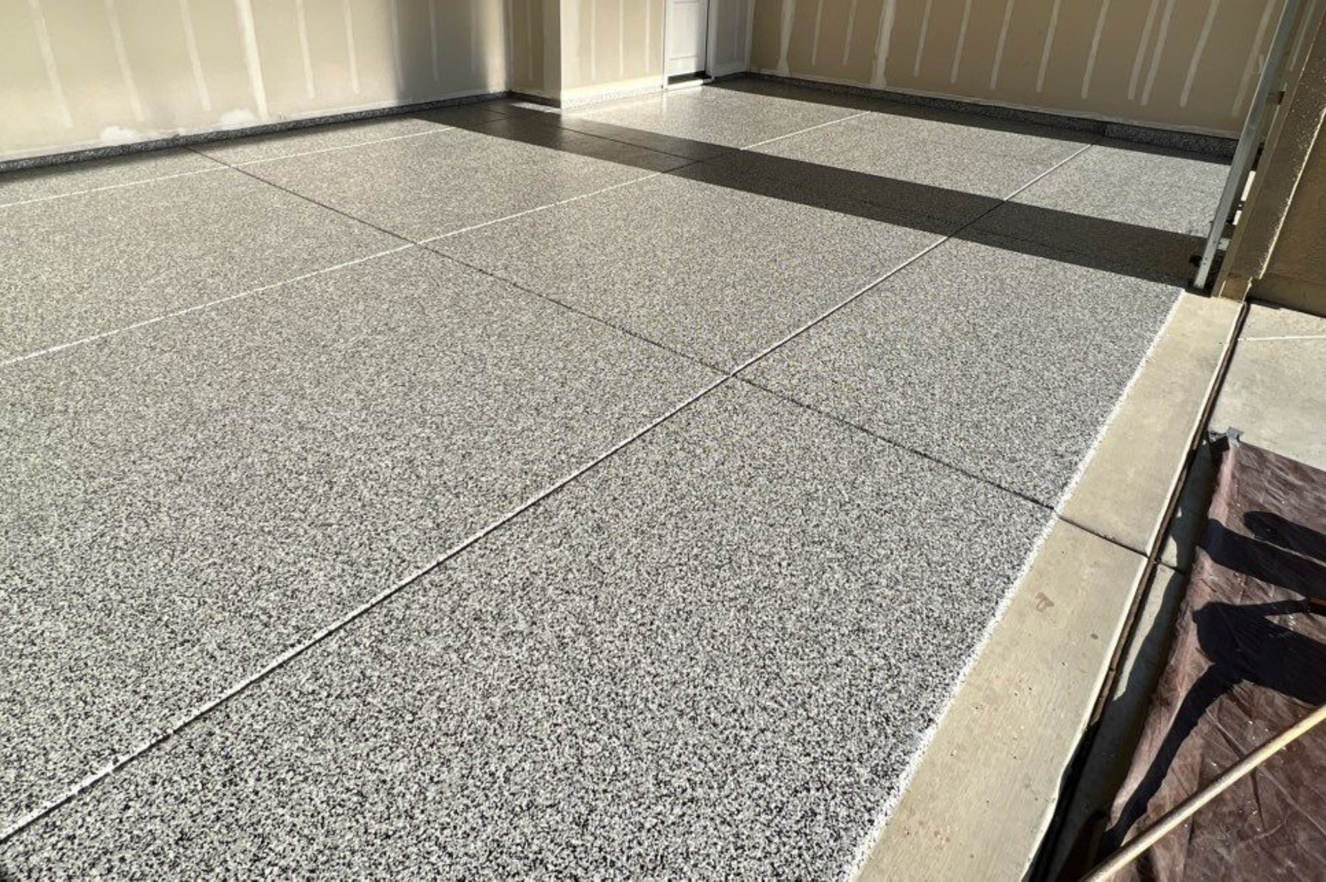 A close up of a concrete floor in a garage.