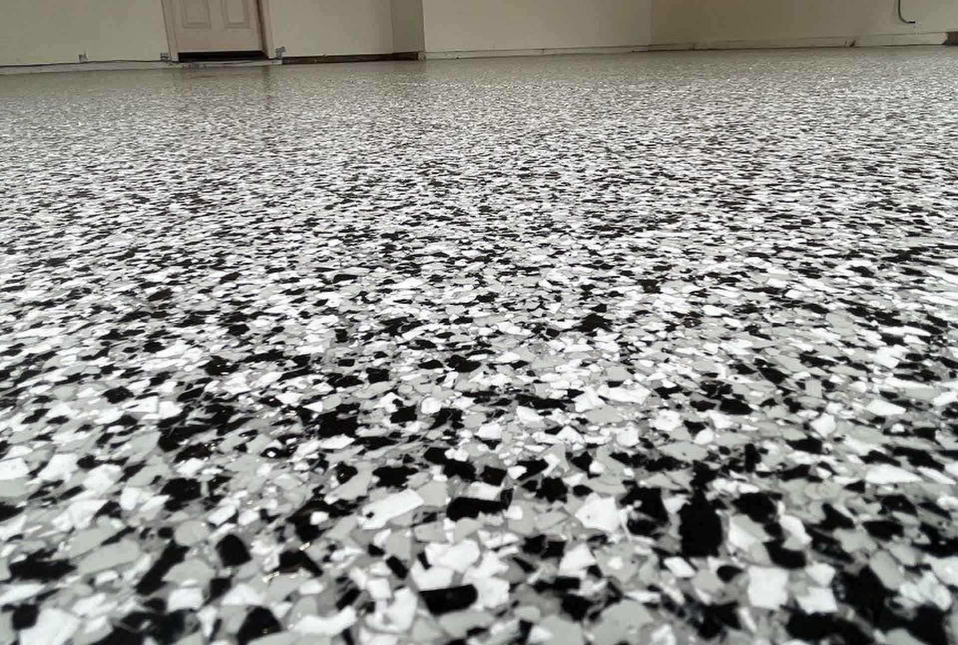 A black and white floor with a lot of small stones on it.