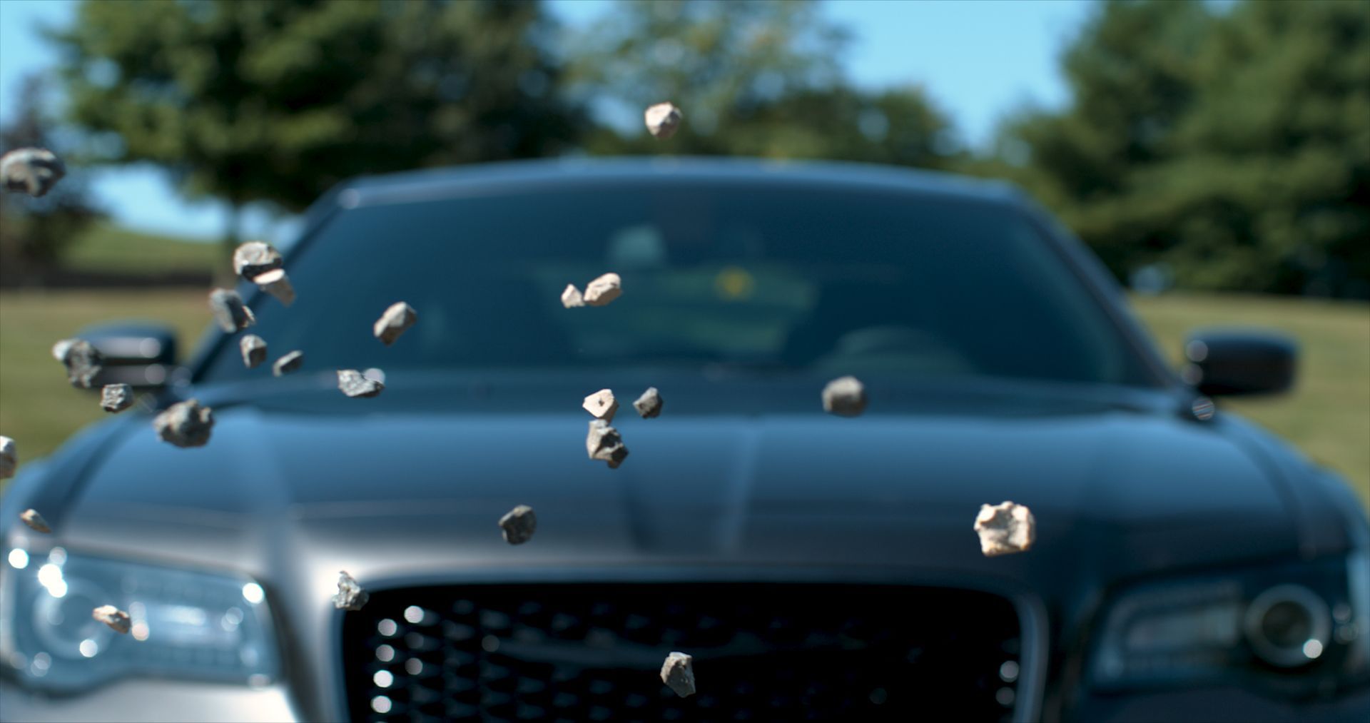 rocks hitting car without damage