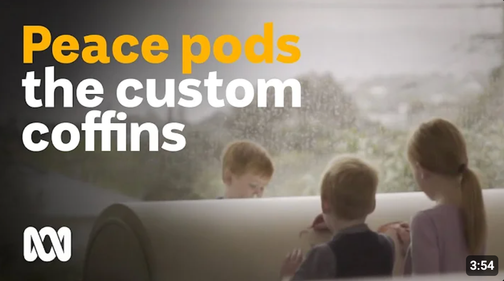 A group of children decorating a PeacePod casket with the words Peacepods the custom coffins above them