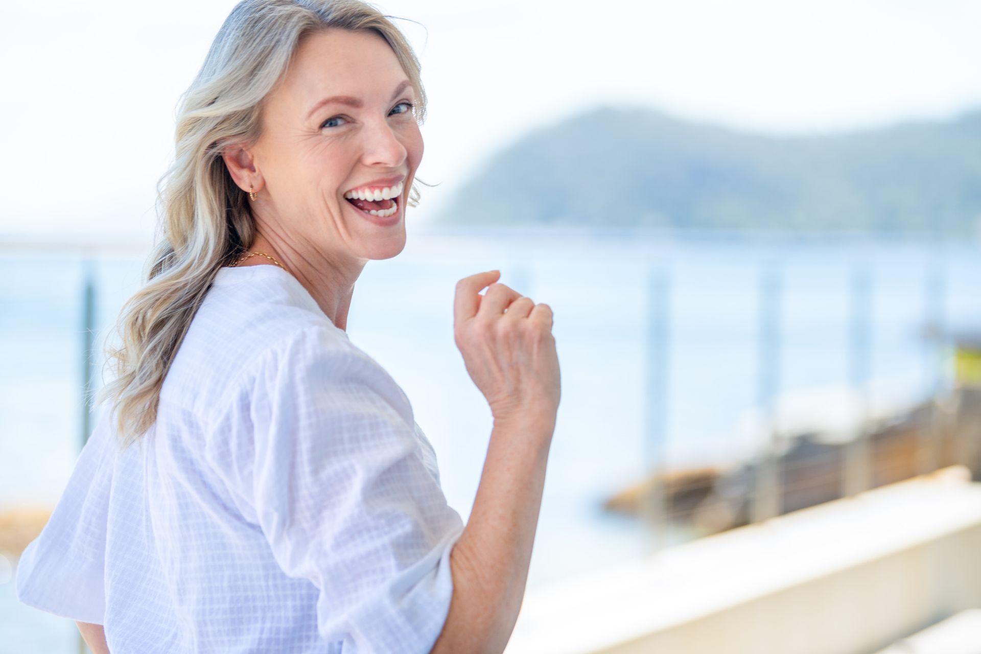 Beautiful mature woman portrait at waterfront house |Rowville Dental Surgery| Glen Waverley 