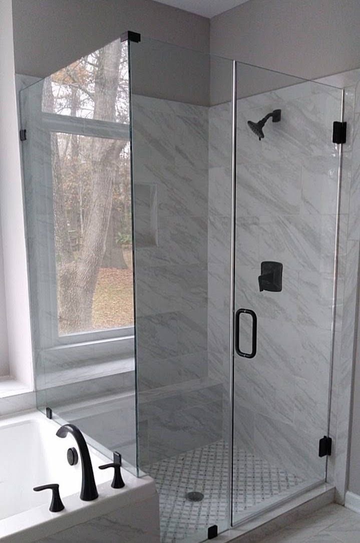Frameless glass shower enclosure with black hardware installed by Camden Glass & Mirror in Columbia, SC