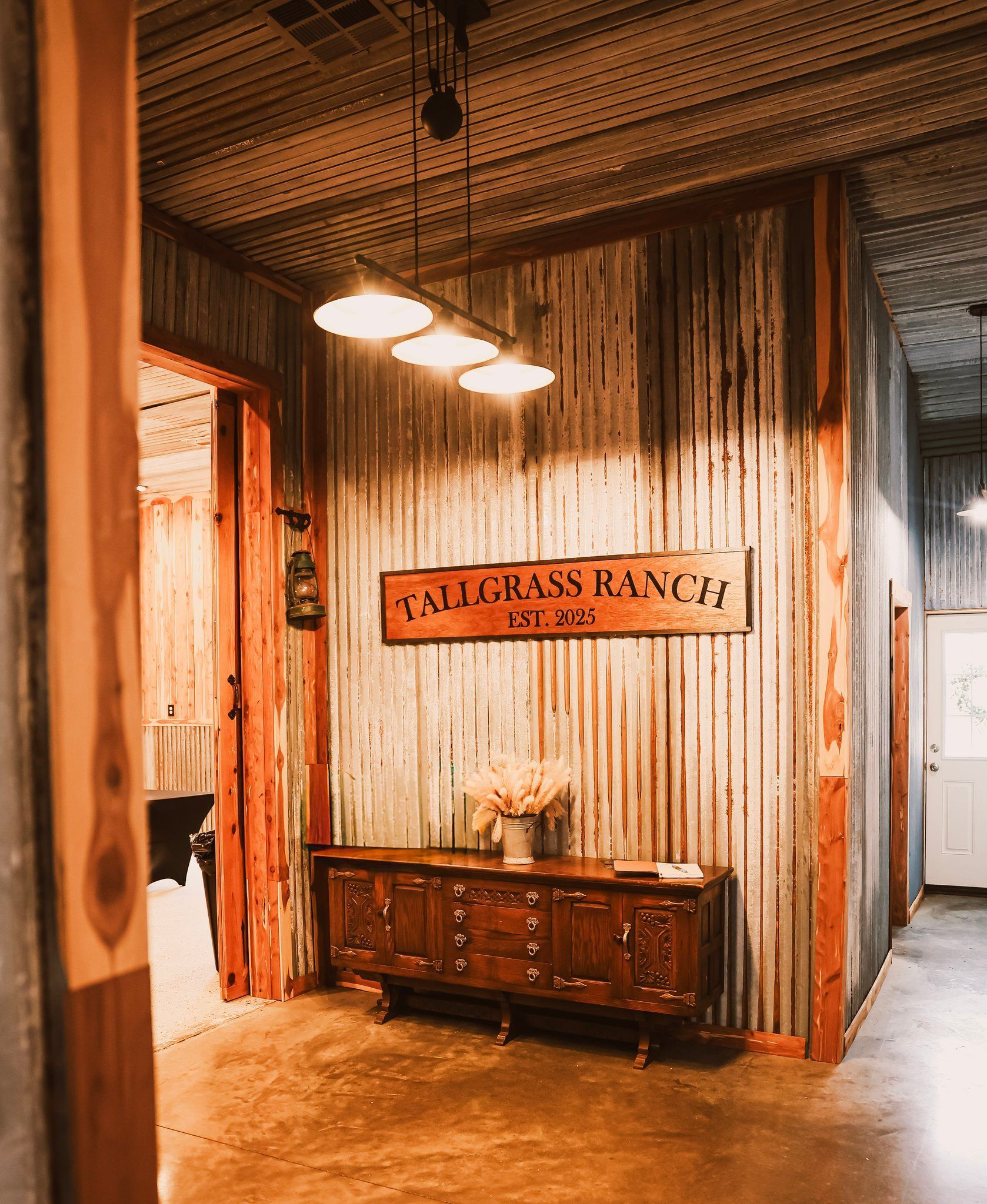 Hallway with corrugated metal walls, wooden trim, and a sign that reads 