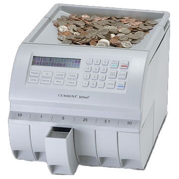 A coin counting machine with a bunch of coins in it