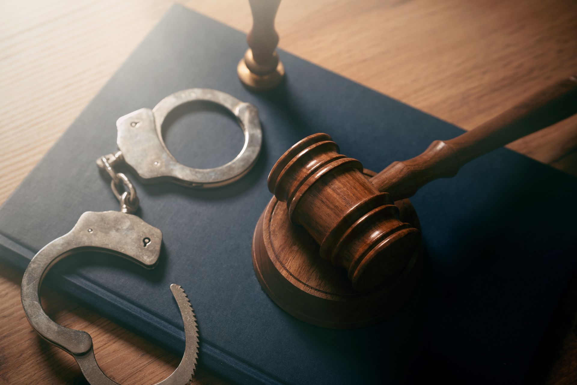 Handcuffs and gavel, symbolizing justice and legal proceedings for a Criminal Defense Attorney in
Ga