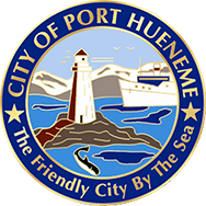 The seal of the city of port huenene shows a lighthouse and a ship in the ocean.
