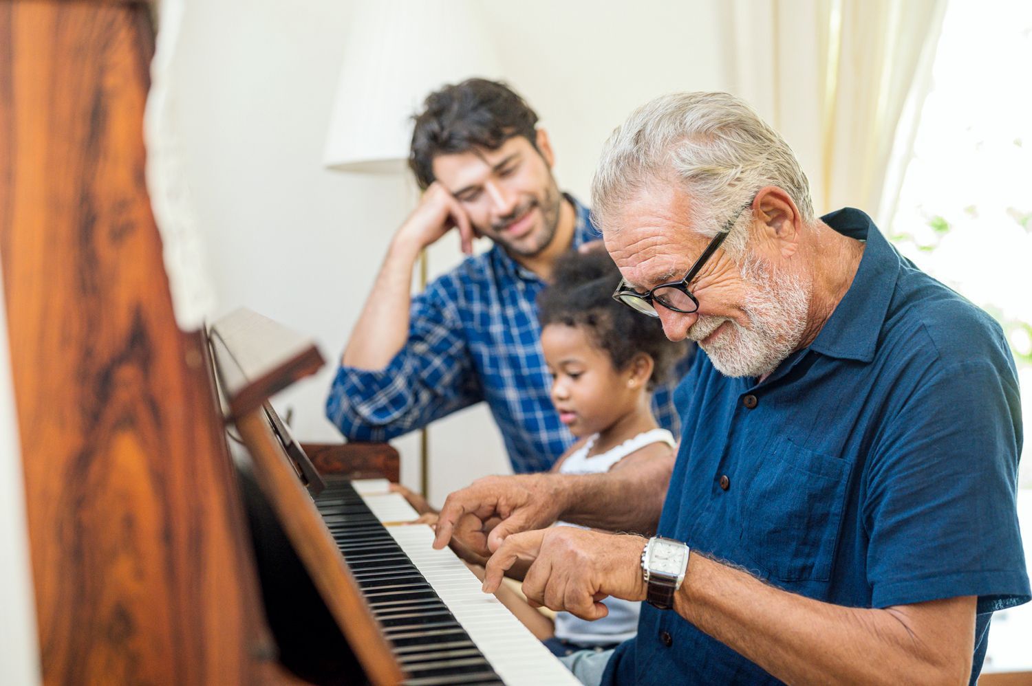 Senior Man Playing Piano— Hampton, NH — Hampton Bay Insurance Agency