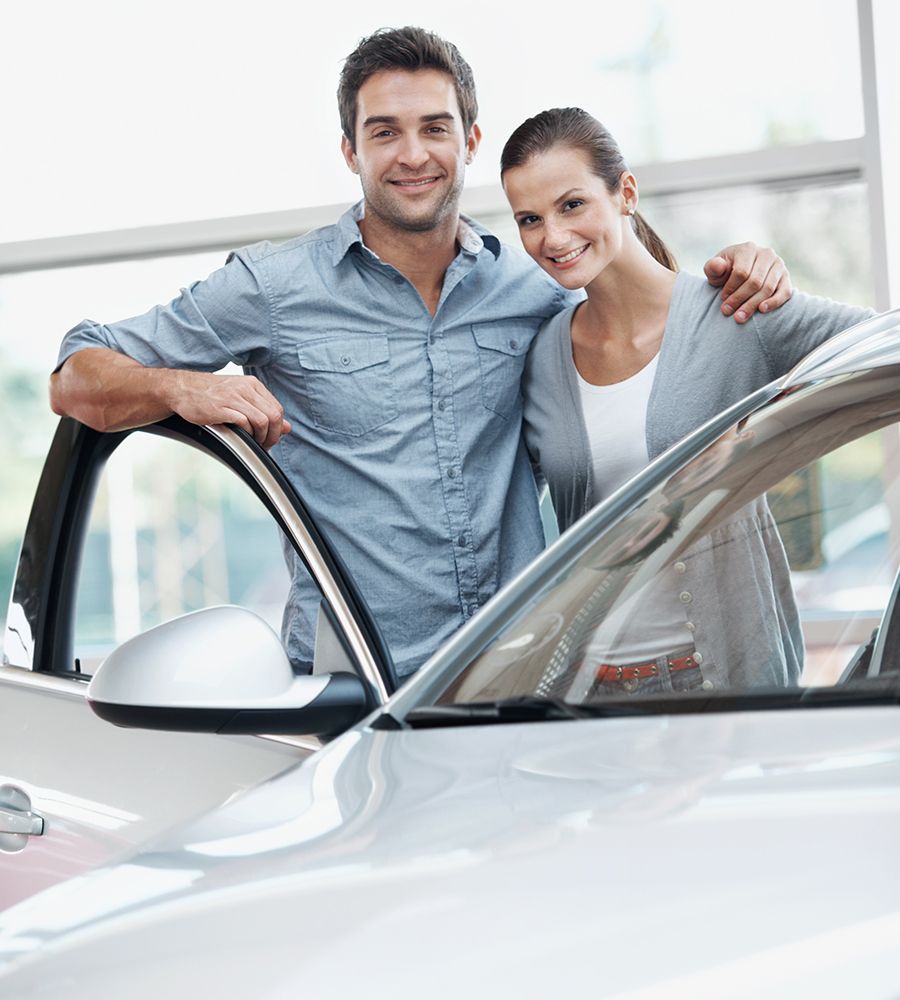 Couple Standing Alongside Their Dream Vehicle — Hampton, NH — Hampton Bay Insurance Agency
