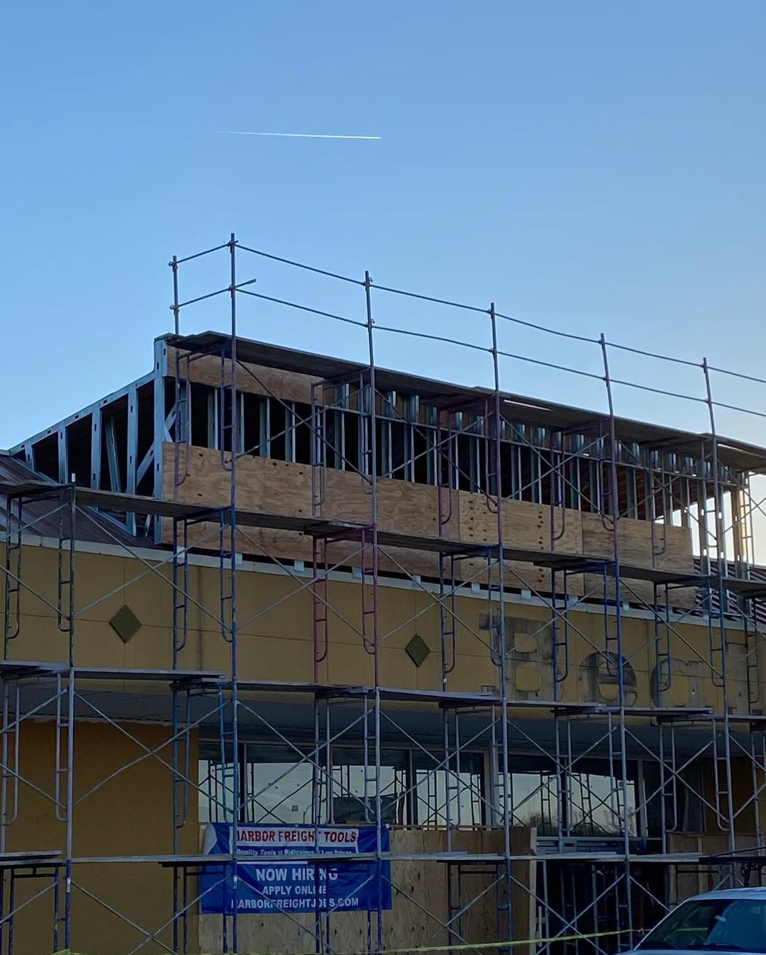 A building under construction with scaffolding around it