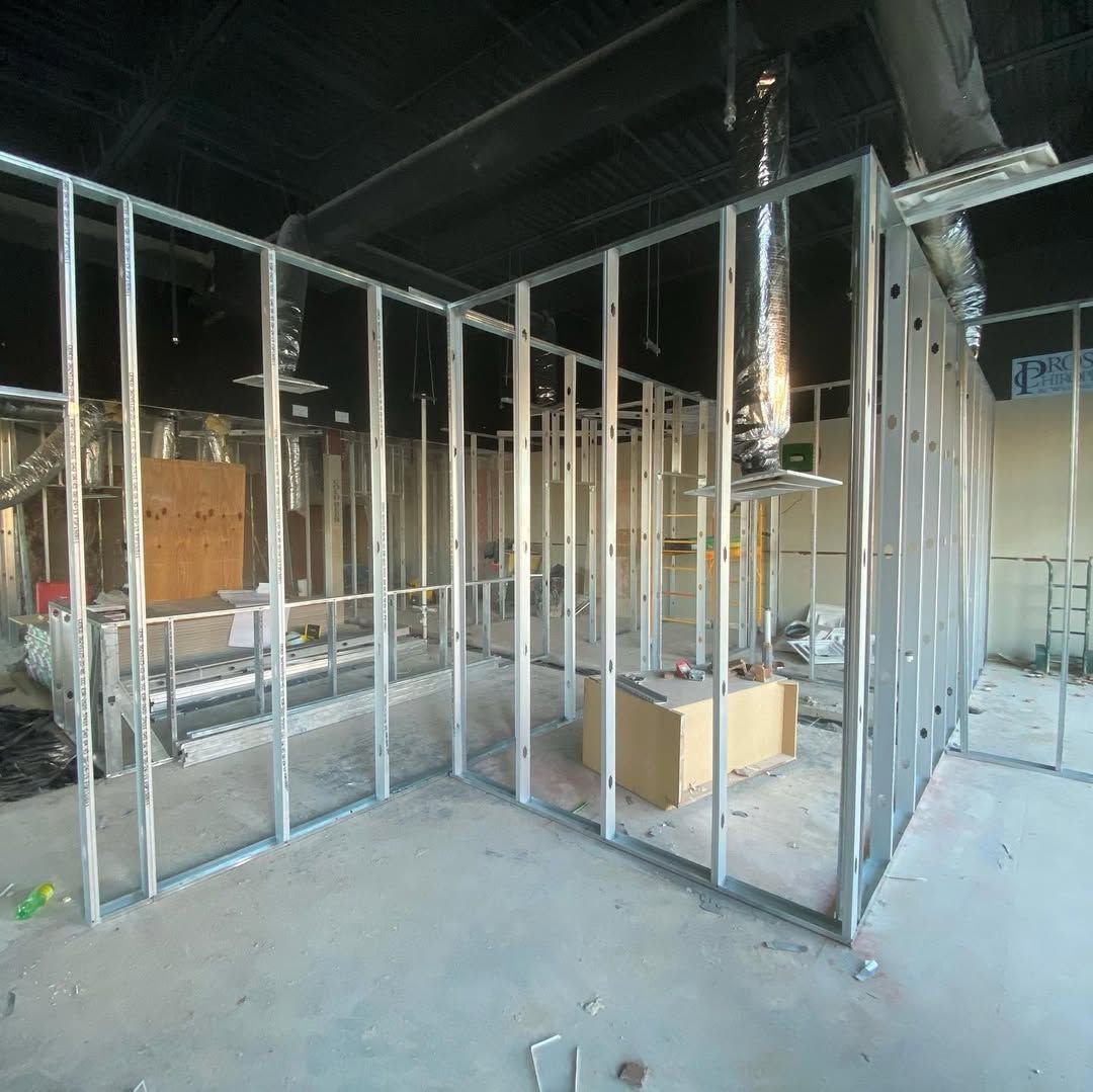 A room under construction with a lot of metal walls.