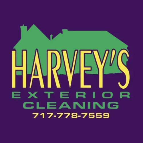 Harvey's Exterior Cleaning logo. Green houses, yellow text "HARVEY'S", purple background, phone number.