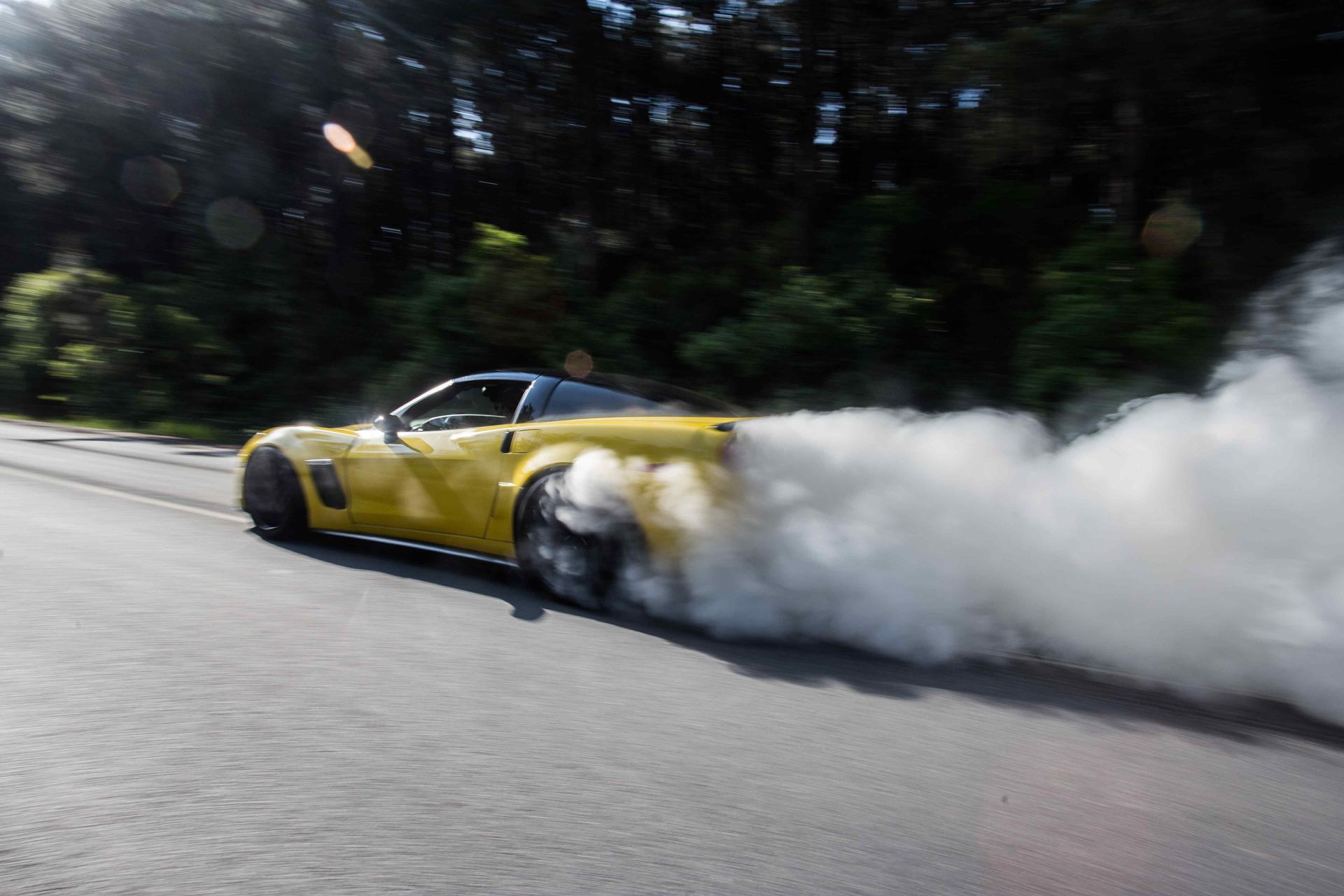 corvette doing a burnout and creating lots of tire smoke