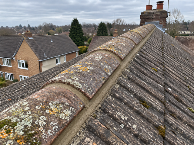 Ridge tiles re-bedded and repointed by Roofers Walkden