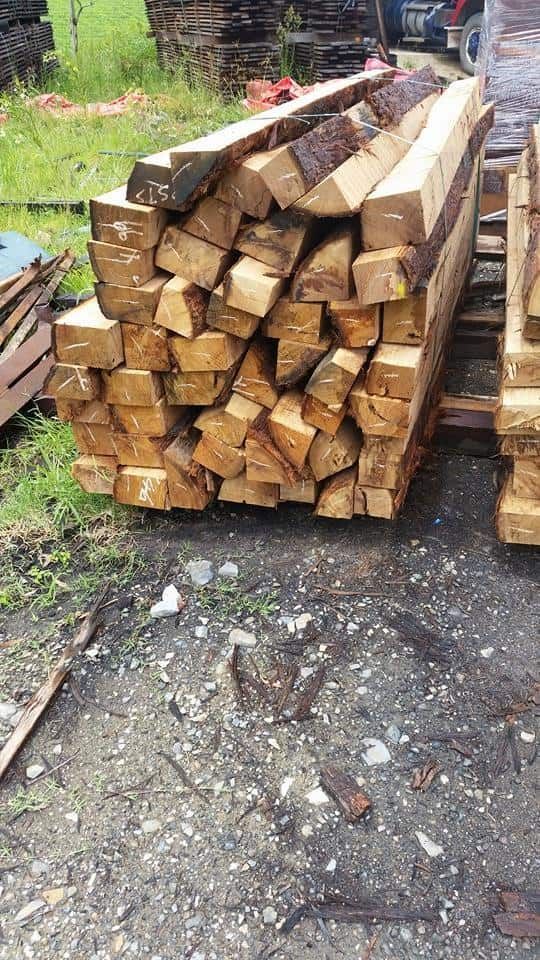 A Pile Of Wood Is Stacked On Top Of Each Other On The Ground — Eungella Sawmill In Crediton, QLD