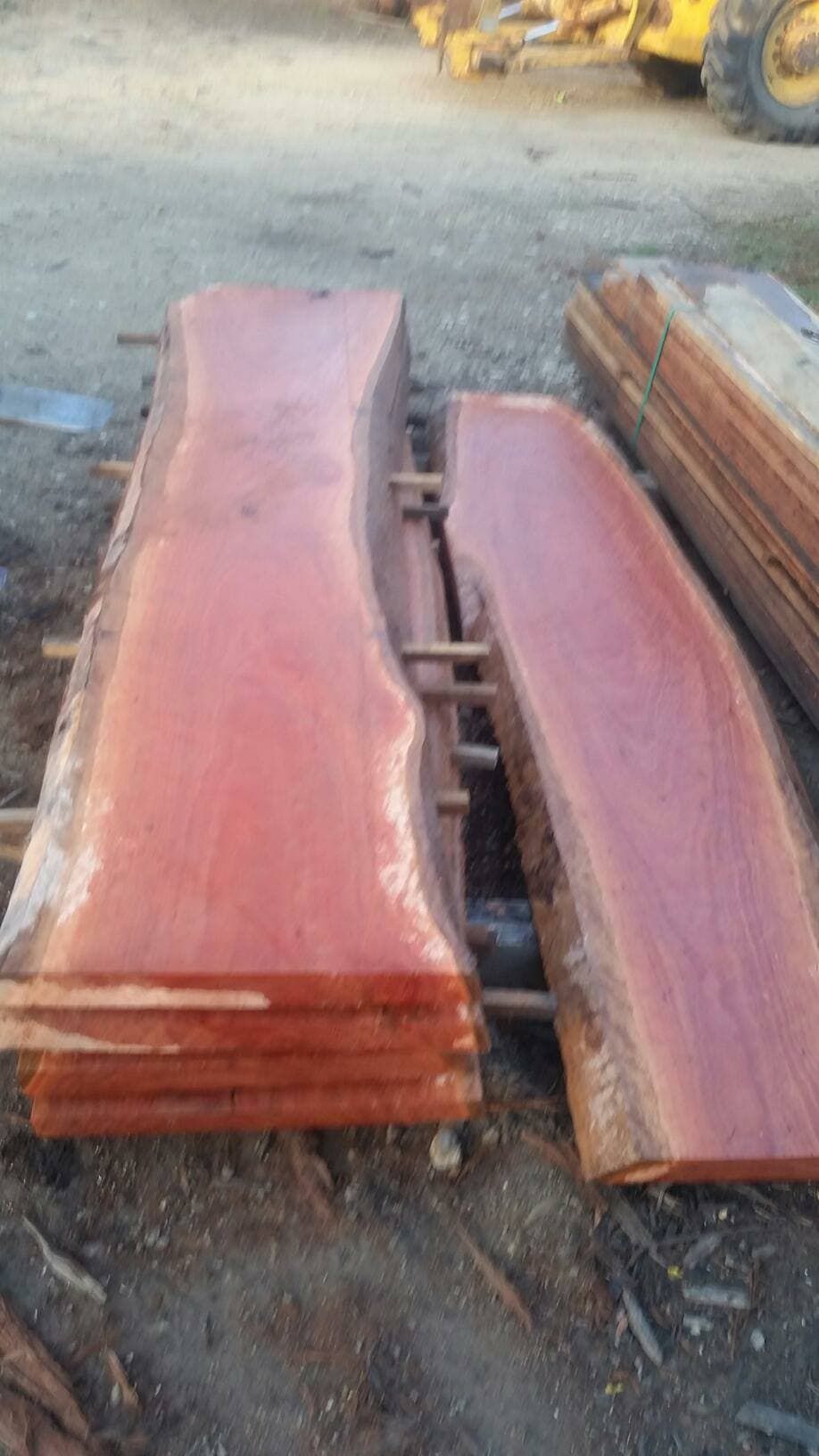 A Stack Of Wooden Boards Sitting On Top Of Each Other On The Ground — Eungella Sawmill In Crediton, QLD