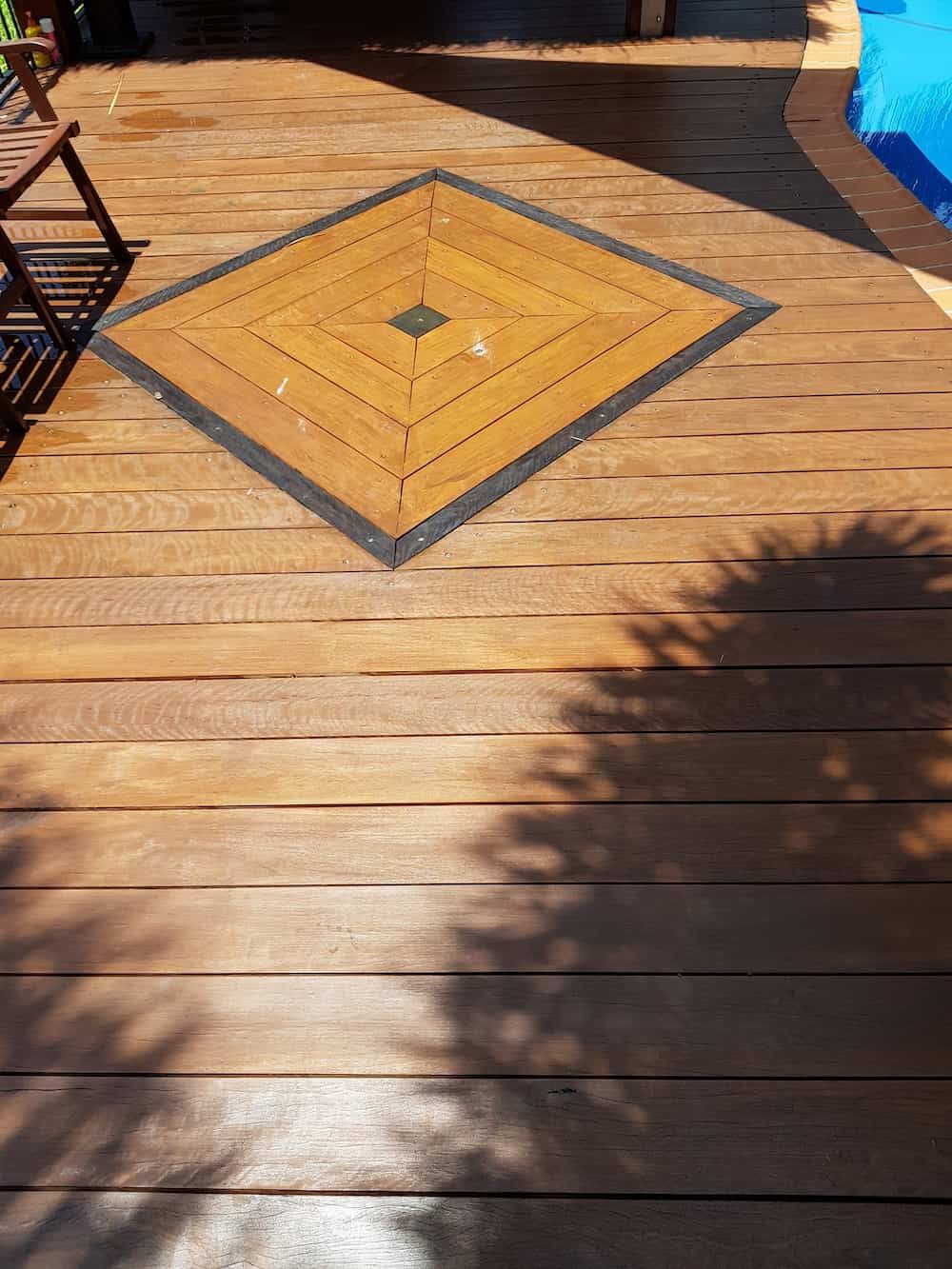 A Wooden Deck With A Diamond Pattern On It Next To A Pool — Eungella Sawmill In Crediton, QLD