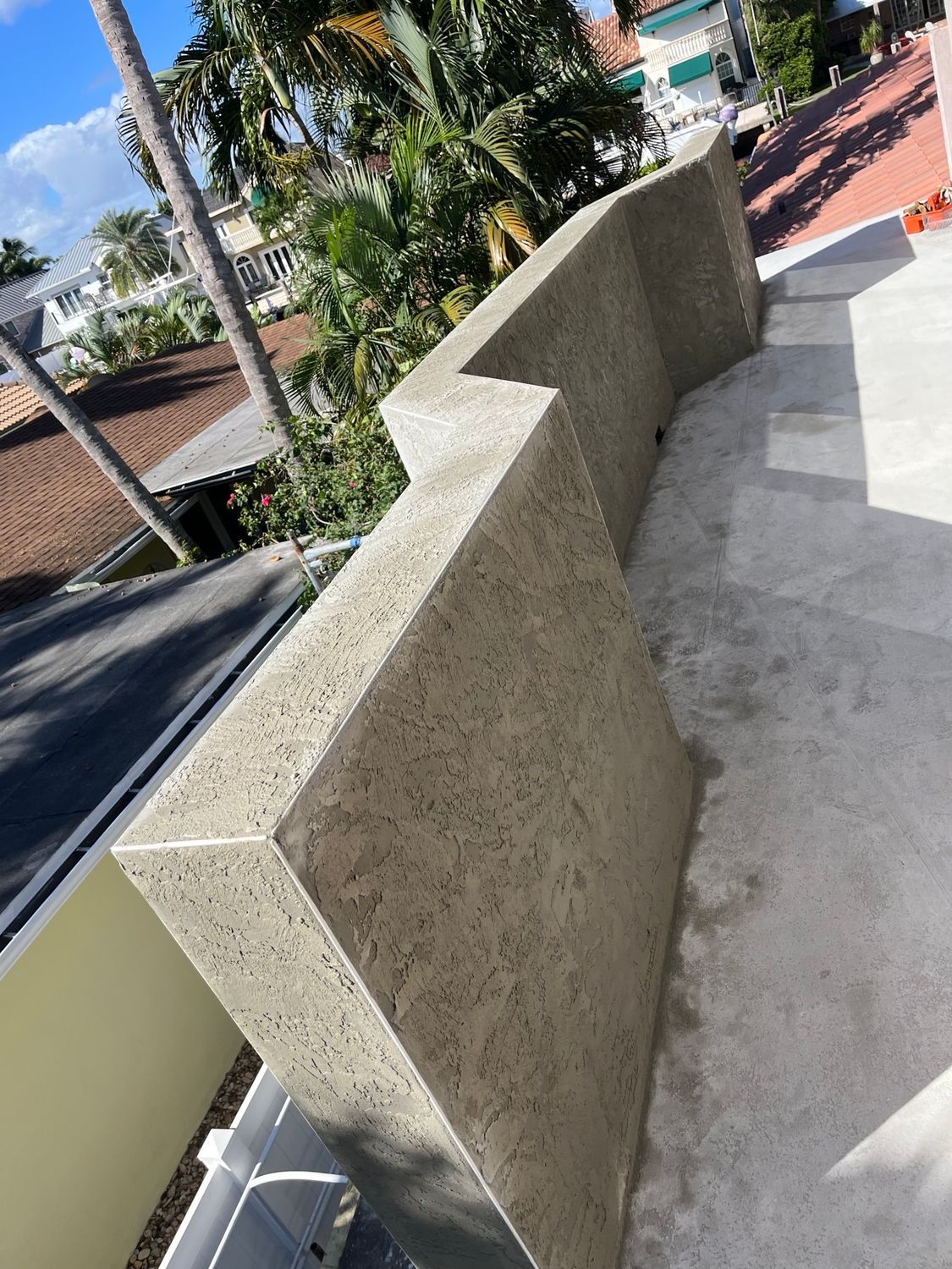 A concrete wall is sitting on top of a concrete staircase.