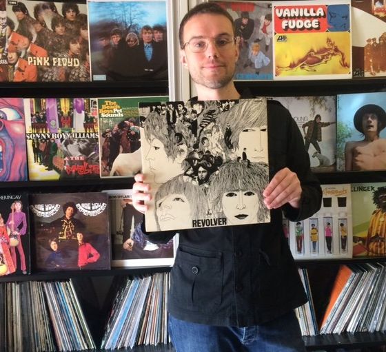 Vintage Records owner Mark with a vinyl collection