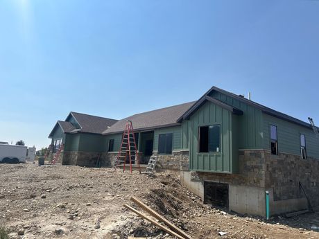 A house is being built in the middle of a dirt field — Ogden, UT — Miller Siding