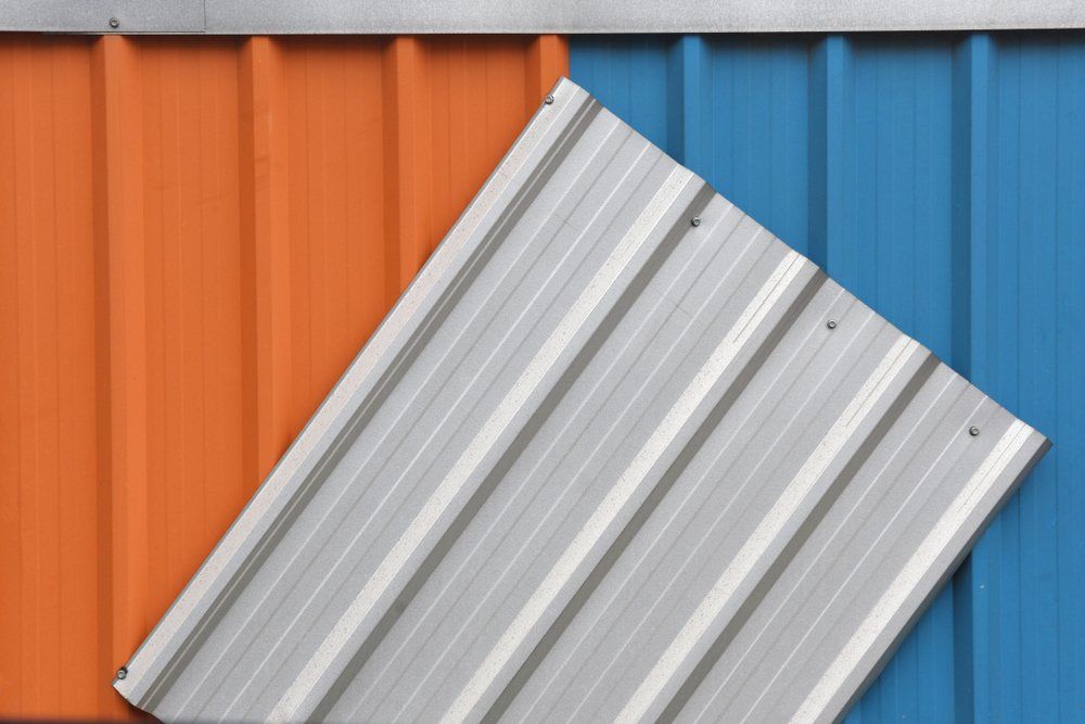 A Close Up of a Blue and Orange Metal Roof — Goulburn Roofing In Crookwell, NSW