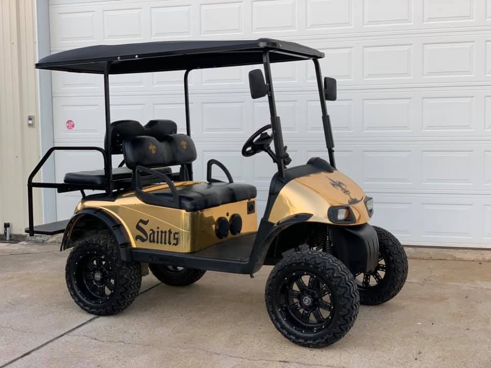Gold and black golf cart with