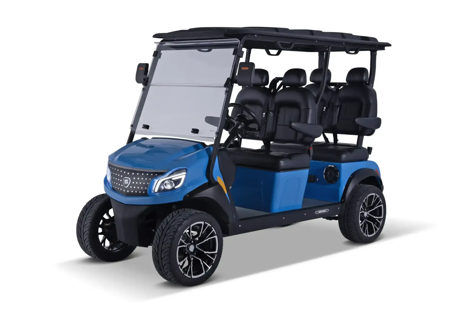 A red and black four-passenger golf cart with custom alloy wheels parked inside a showroom with various parts.