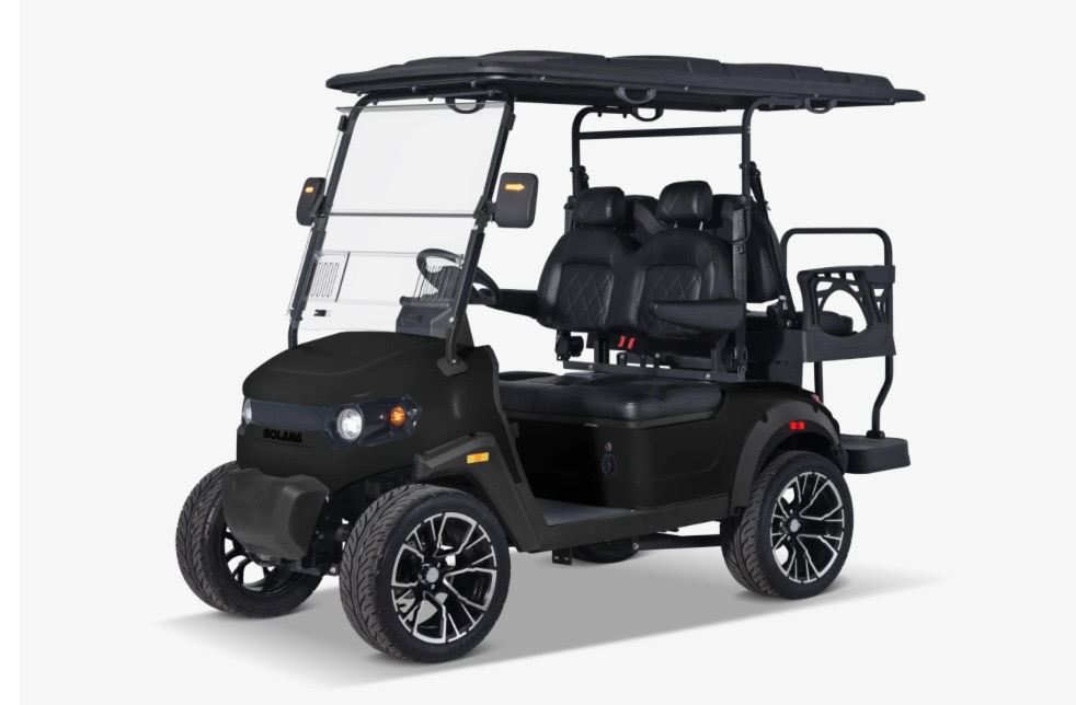 Black golf cart with a roof, four seats, and off-road tires on a white background