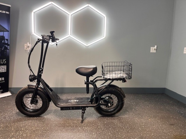 Gray electric fat tire bike with cargo rack, free bike cover included.