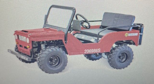 Red mini jeep with black wheels, windshield, and seat, outdoors.