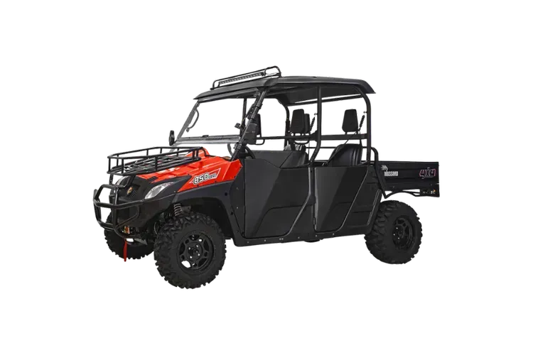 Red and black side-by-side utility vehicle with a roof, rack, and cargo bed on a white background.
