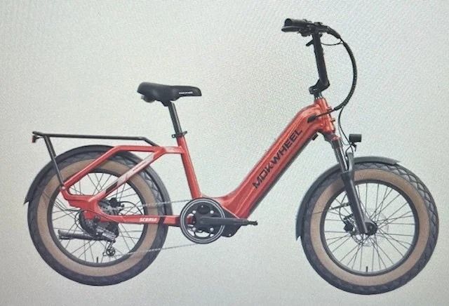 Red electric bike with tan fat tires and rear rack.