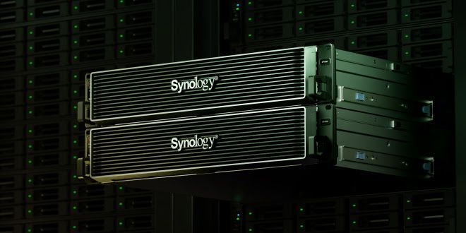 Two synology servers are stacked on top of each other in a server room.