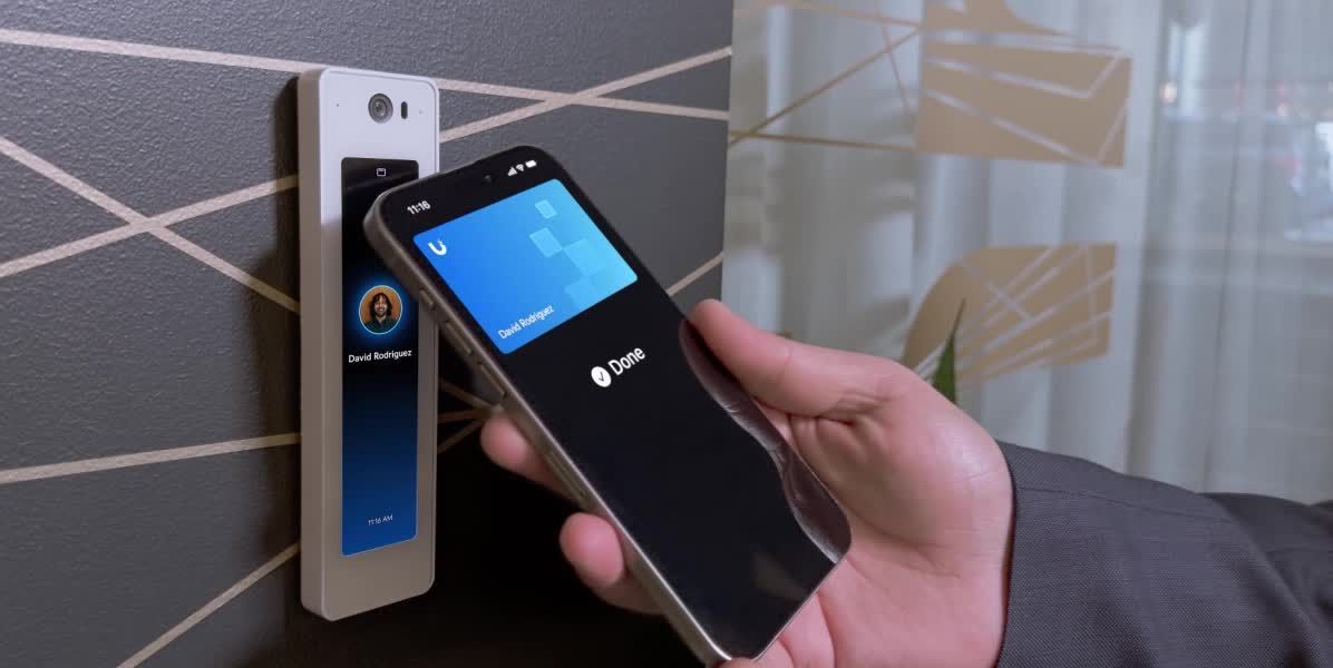 A man is pressing a button on a screen that says compliance.