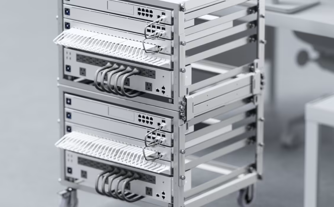 A man is working on a server in a data center.