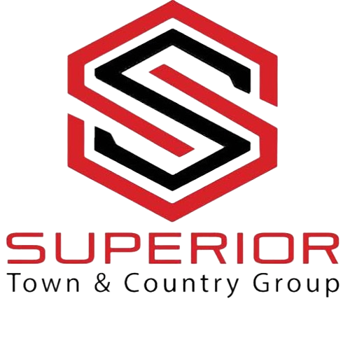 The logo for superior town and country realty llc shows a bird flying over a house.