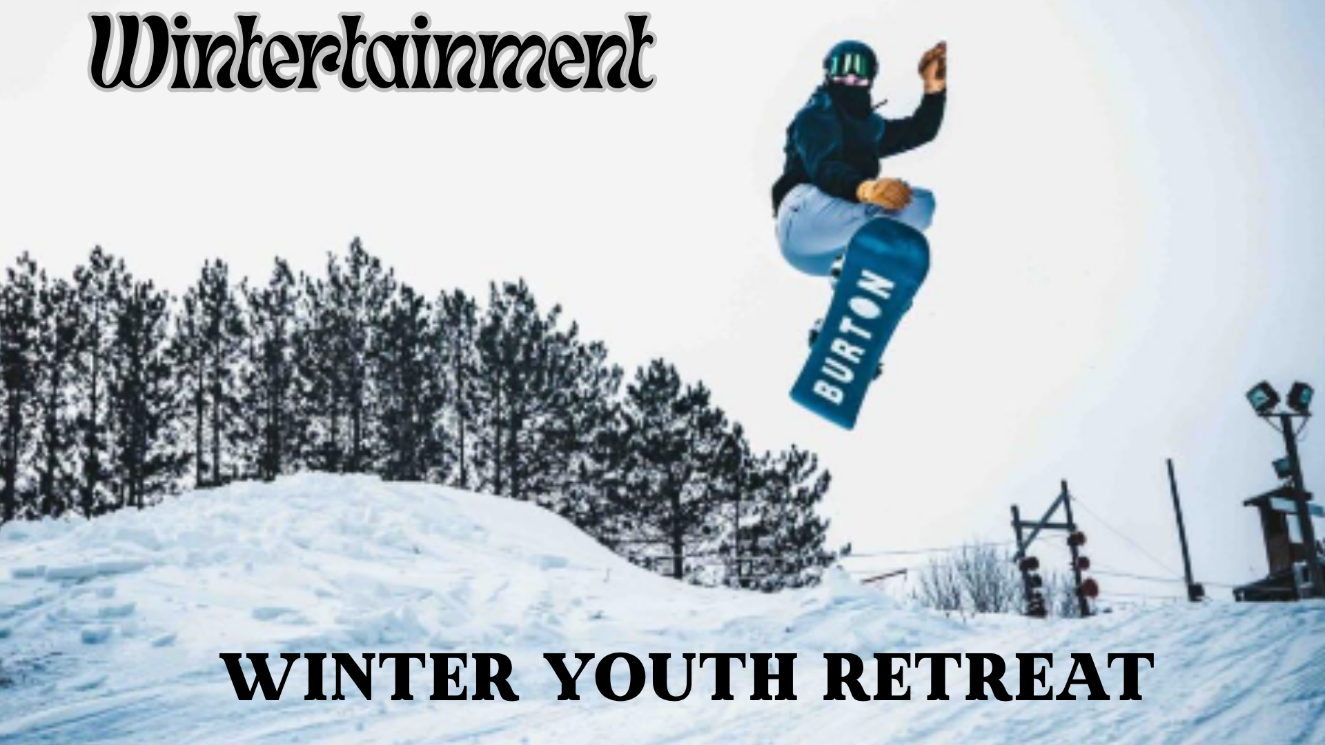 Snowboarder in mid-air above a snowy slope.