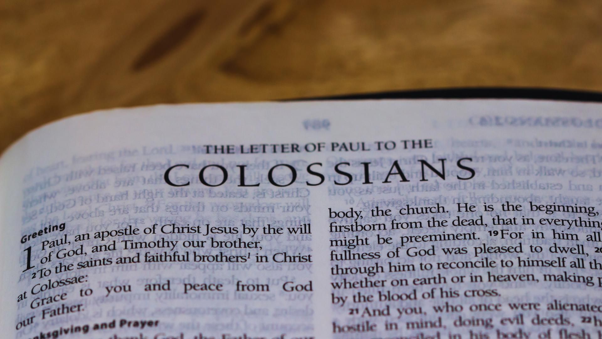 The word colossians is on the page of a bible