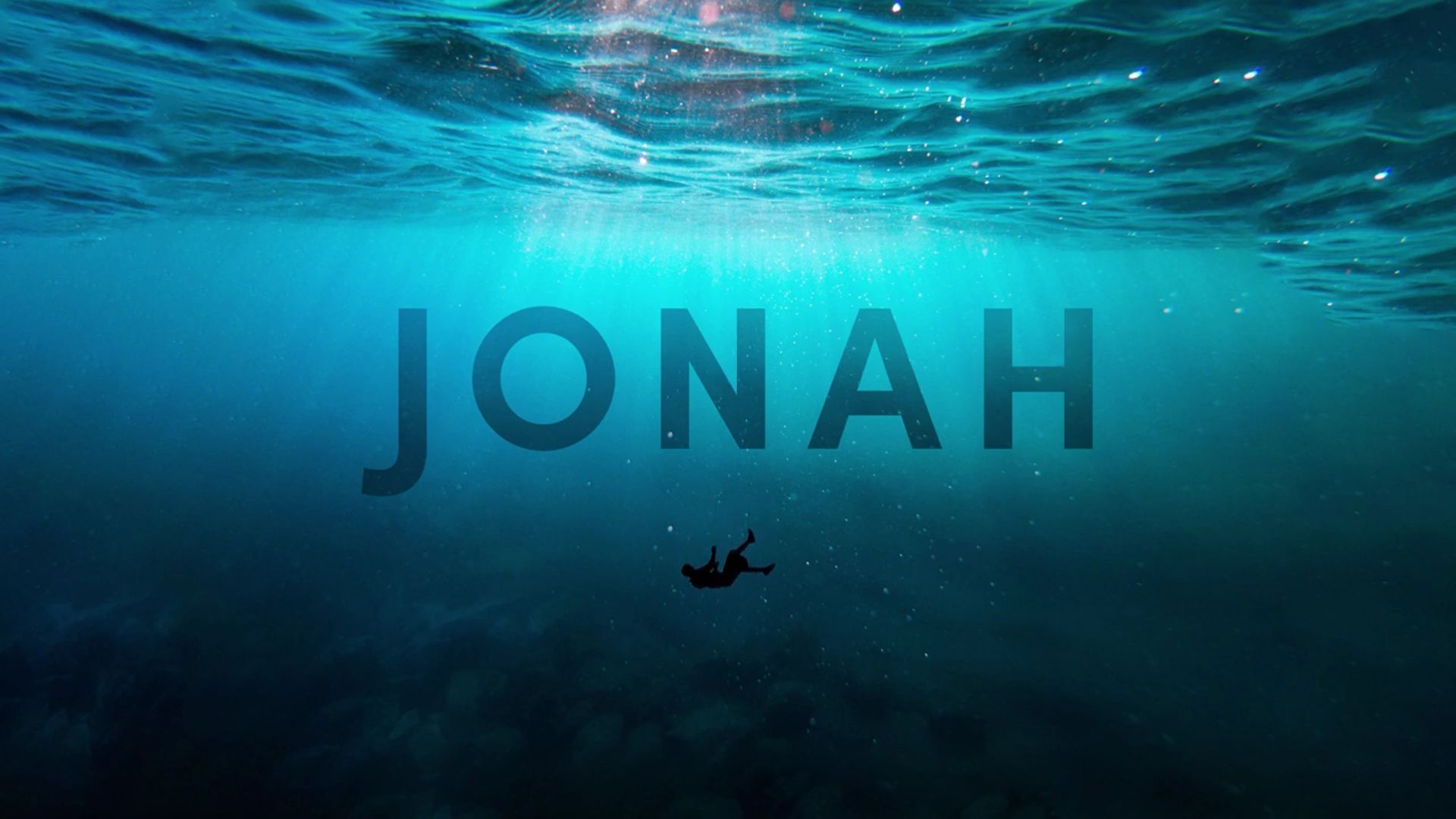 Man falling in ocean depths, text 