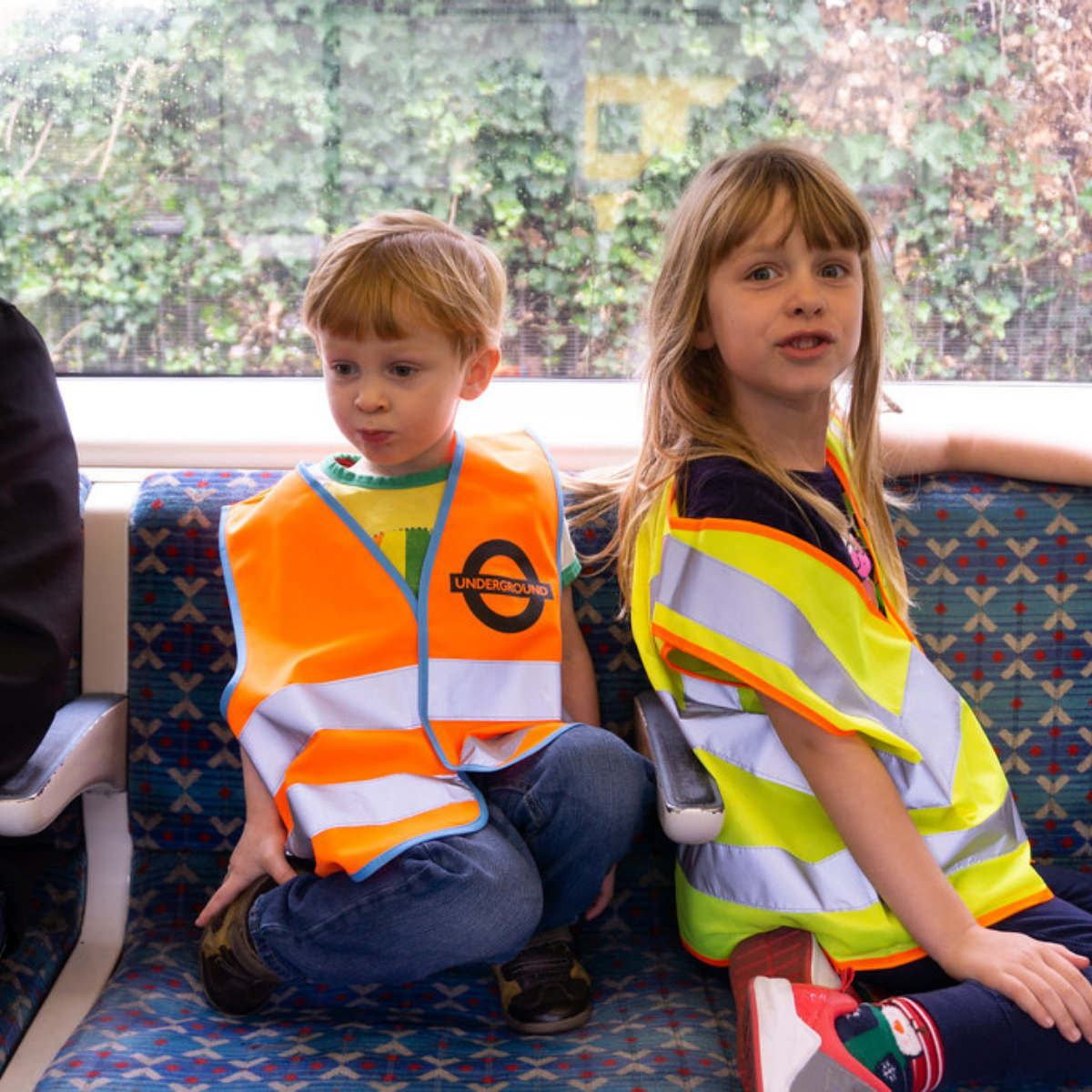 School kids wearing hi-vis vests on way to school