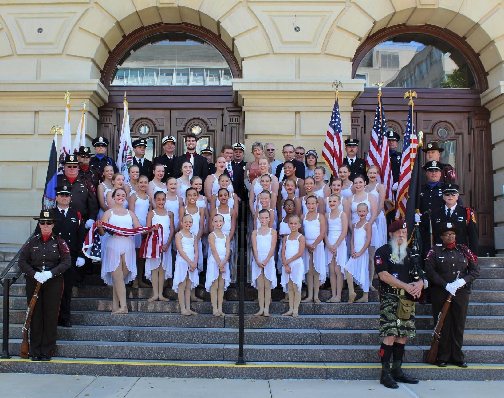 A group of people posing for a picture in front of a building | Springfield, IL | Dance Creations Dance Studio