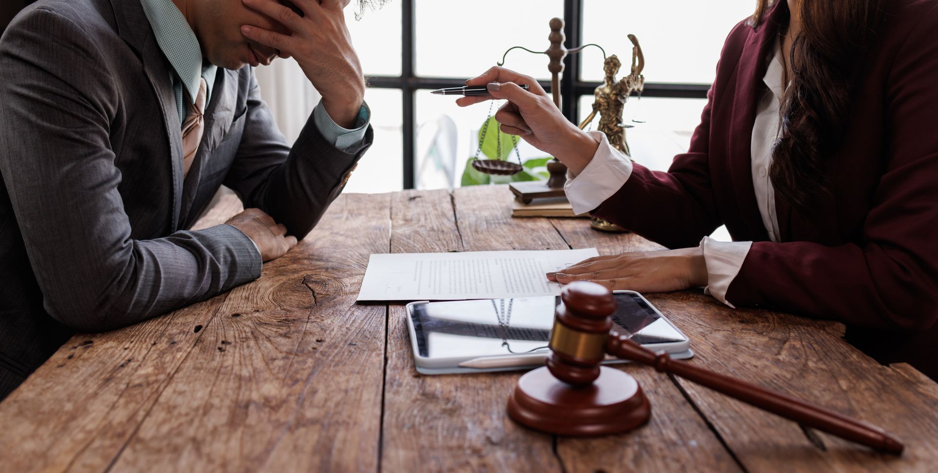 Legal Consultation, Businessman and lawyer discuss the Law contract document.