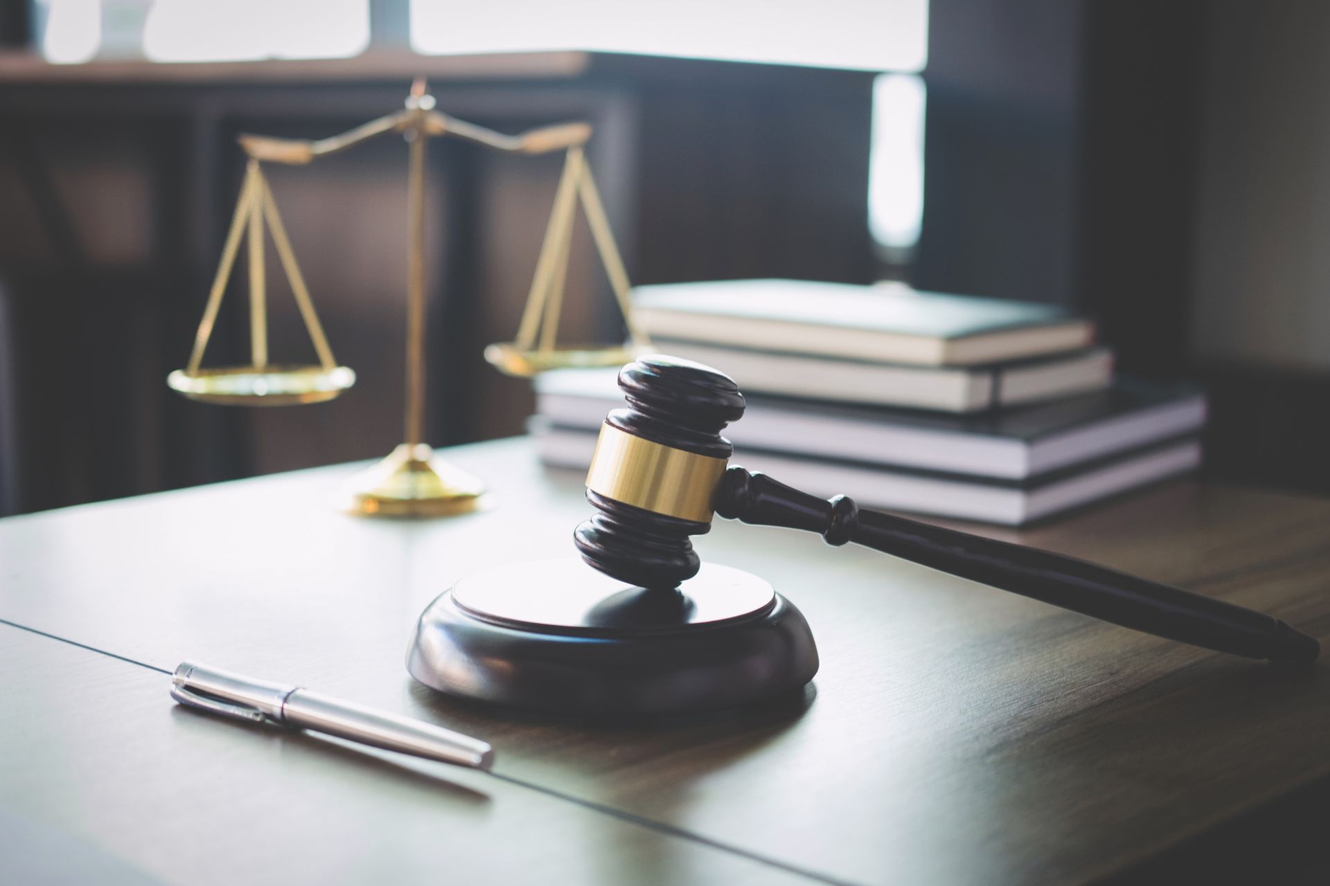 Scales of justice and gavel on table symbolizing bankruptcy law attorney legal services