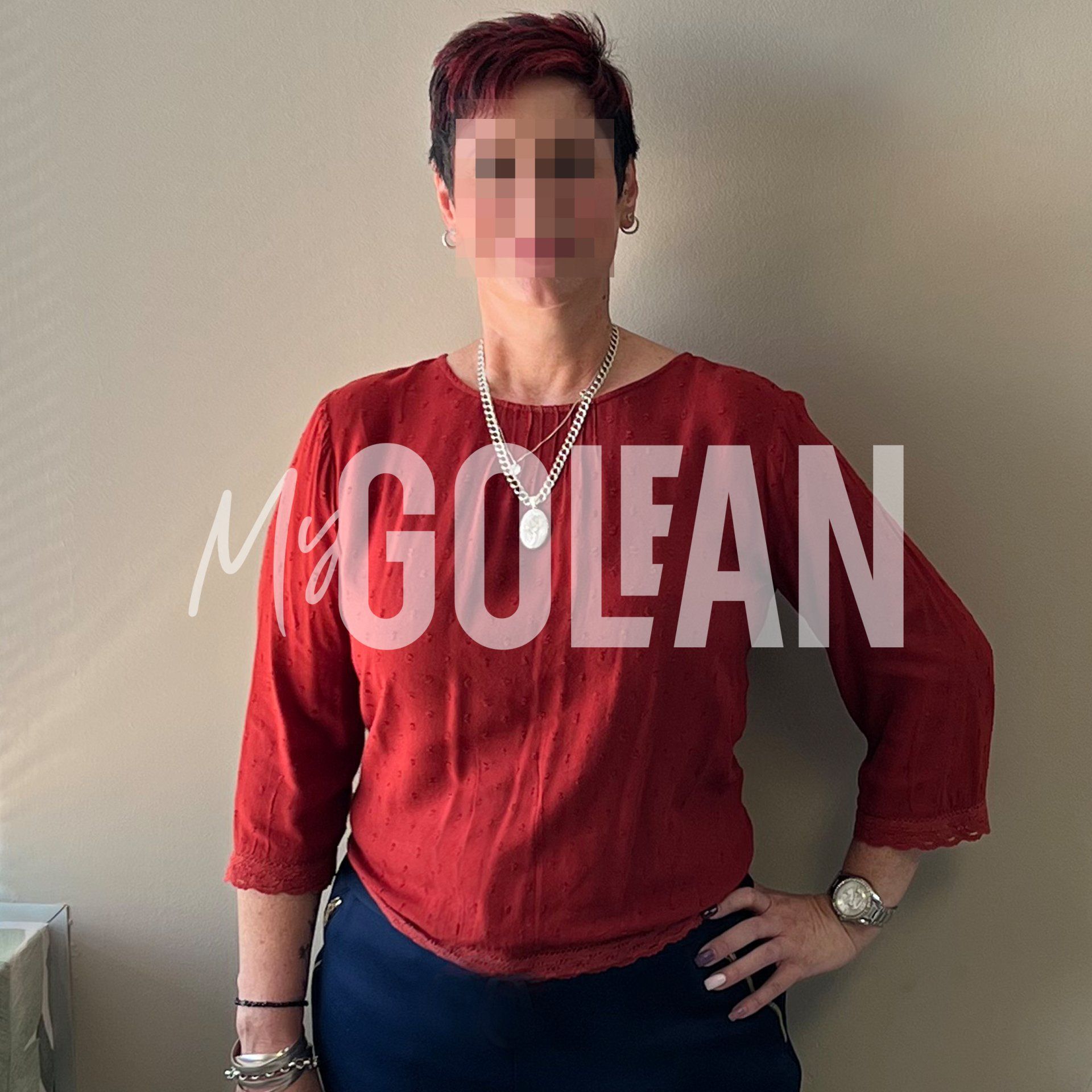 A woman wearing a red shirt with the name mclean on it