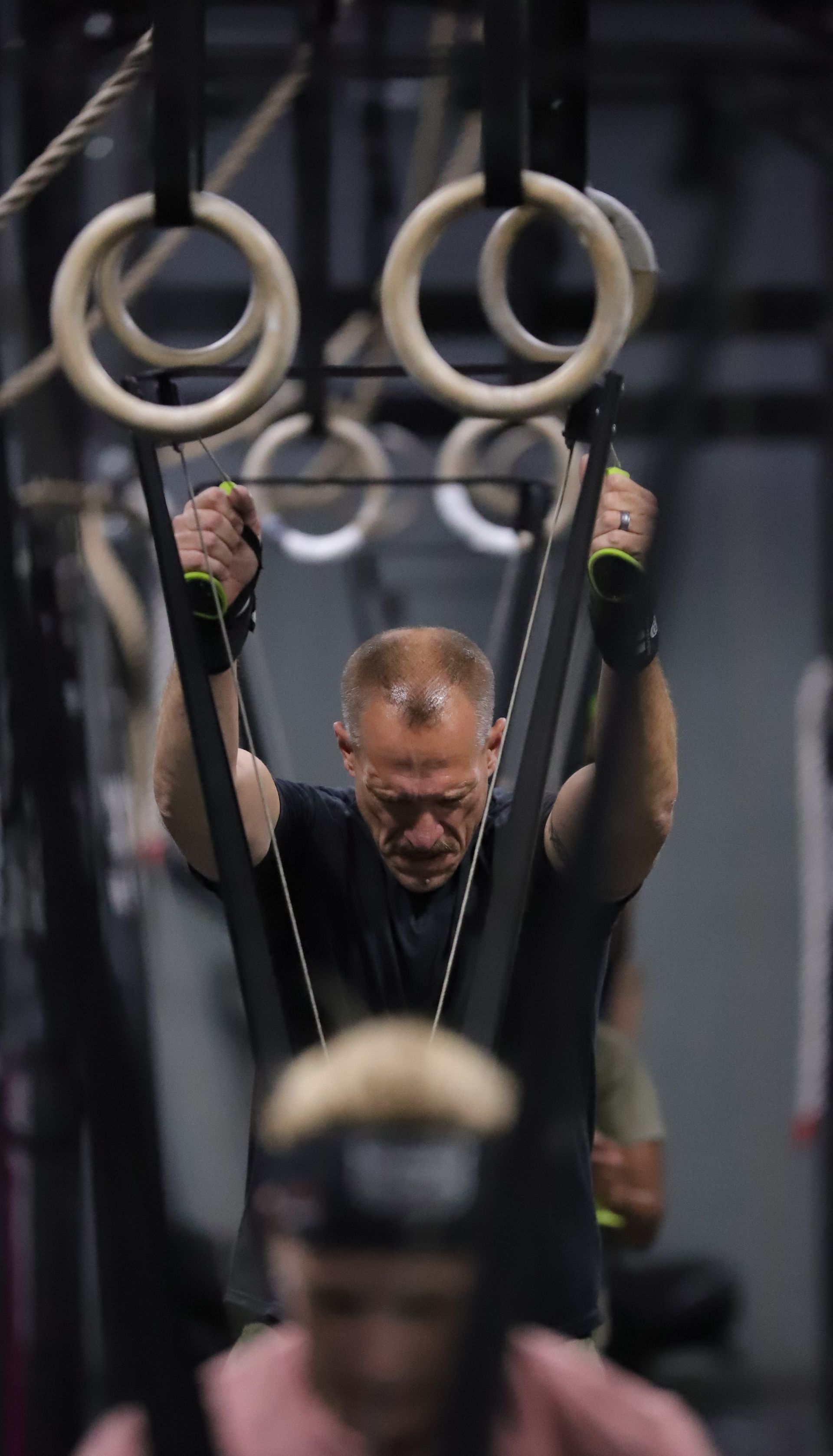 A man using a skiing cardio machine.