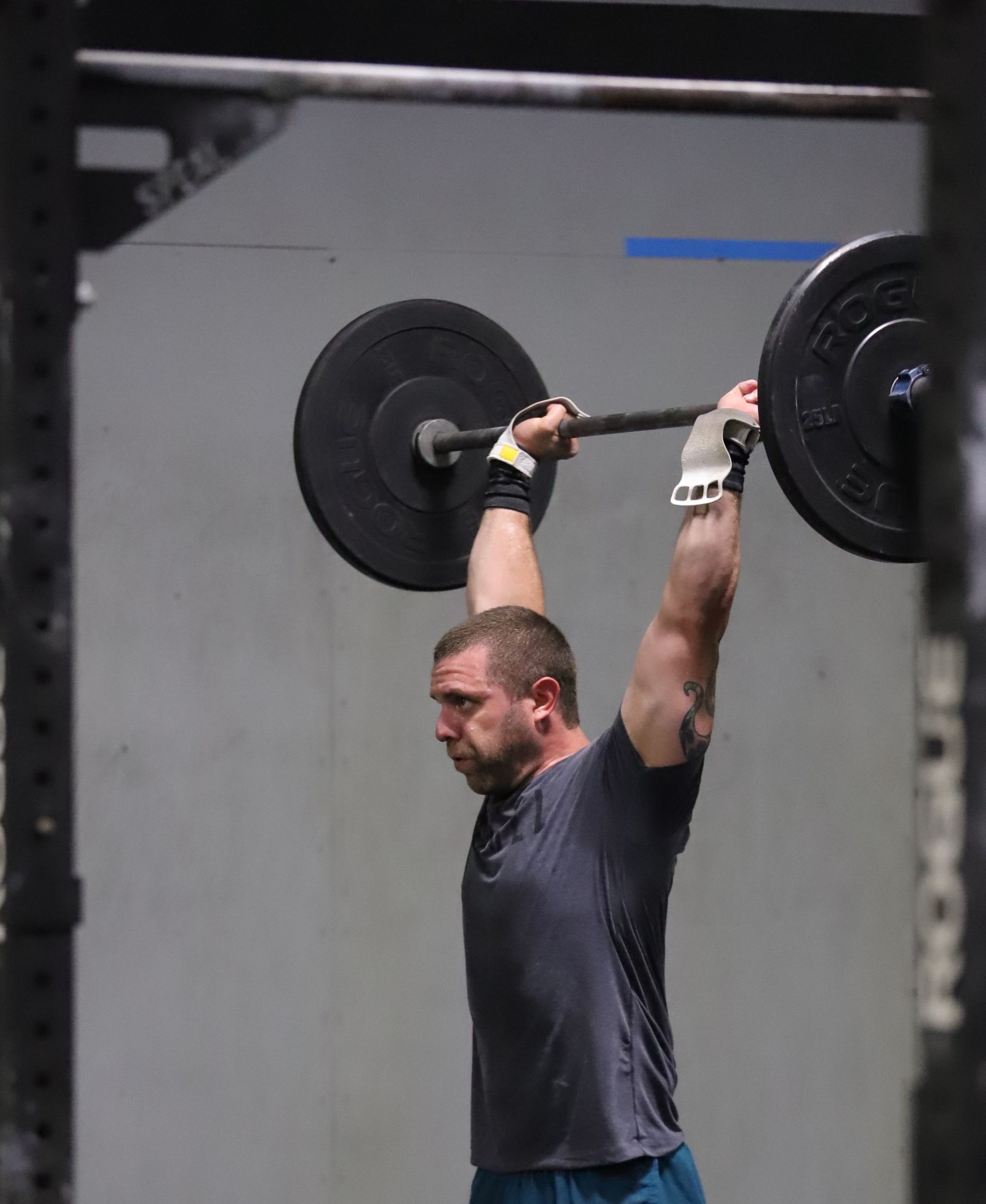 A man with a barbell overhead