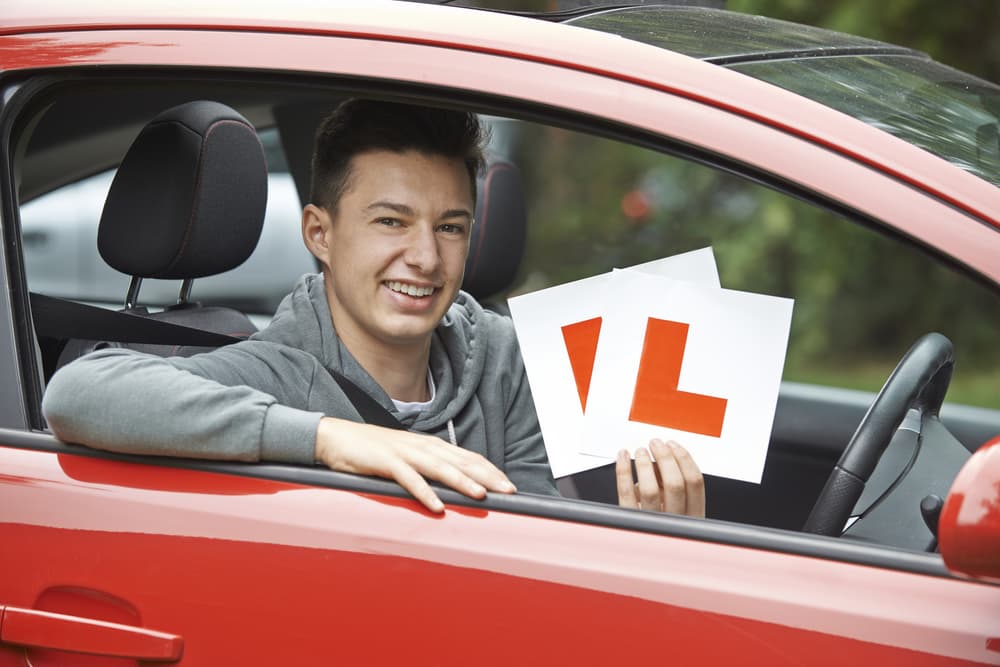 Student Holding L Plates — NT Driving Academy in Woolner, NT